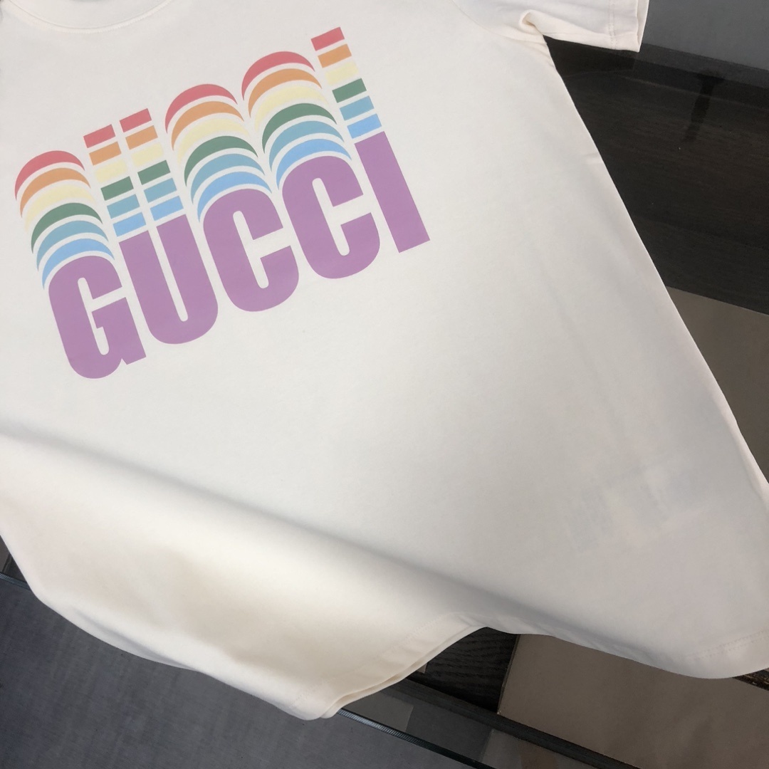 Gucci white T-shirt features a colorful, retro-inspired rainbow logo graphic