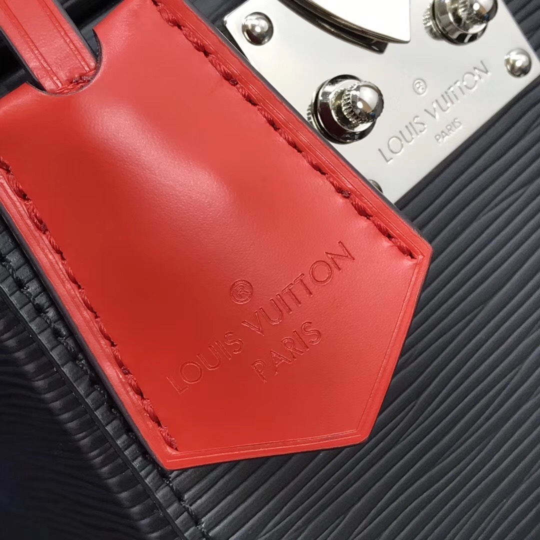 LV Bleecker Box bag is a structured vanity-style shoulder bag crafted from signature black Epi leather, featuring a top handle, silver-tone S-lock hardware, and a removable shoulder strap.