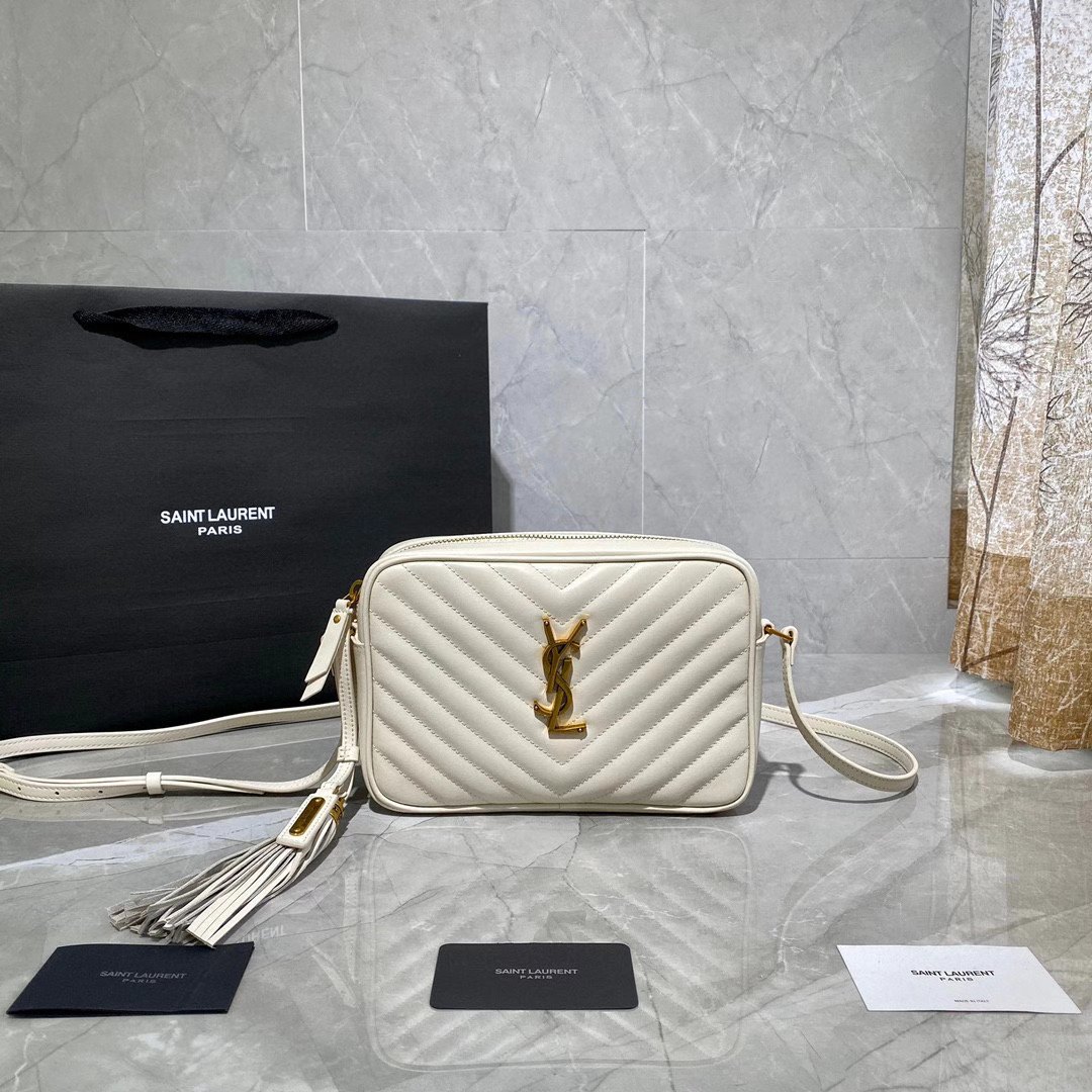 Saint Laurent Lou camera bag is crafted from white quilted leather and features the signature gold-tone YSL monogram plaque.