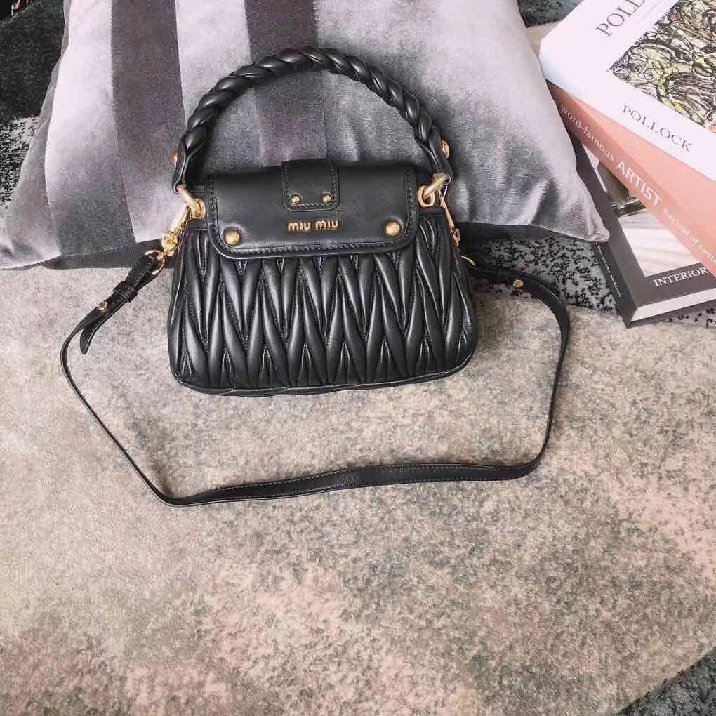 Miu Miu Coffer bag made of matelassé leather with a braided top handle