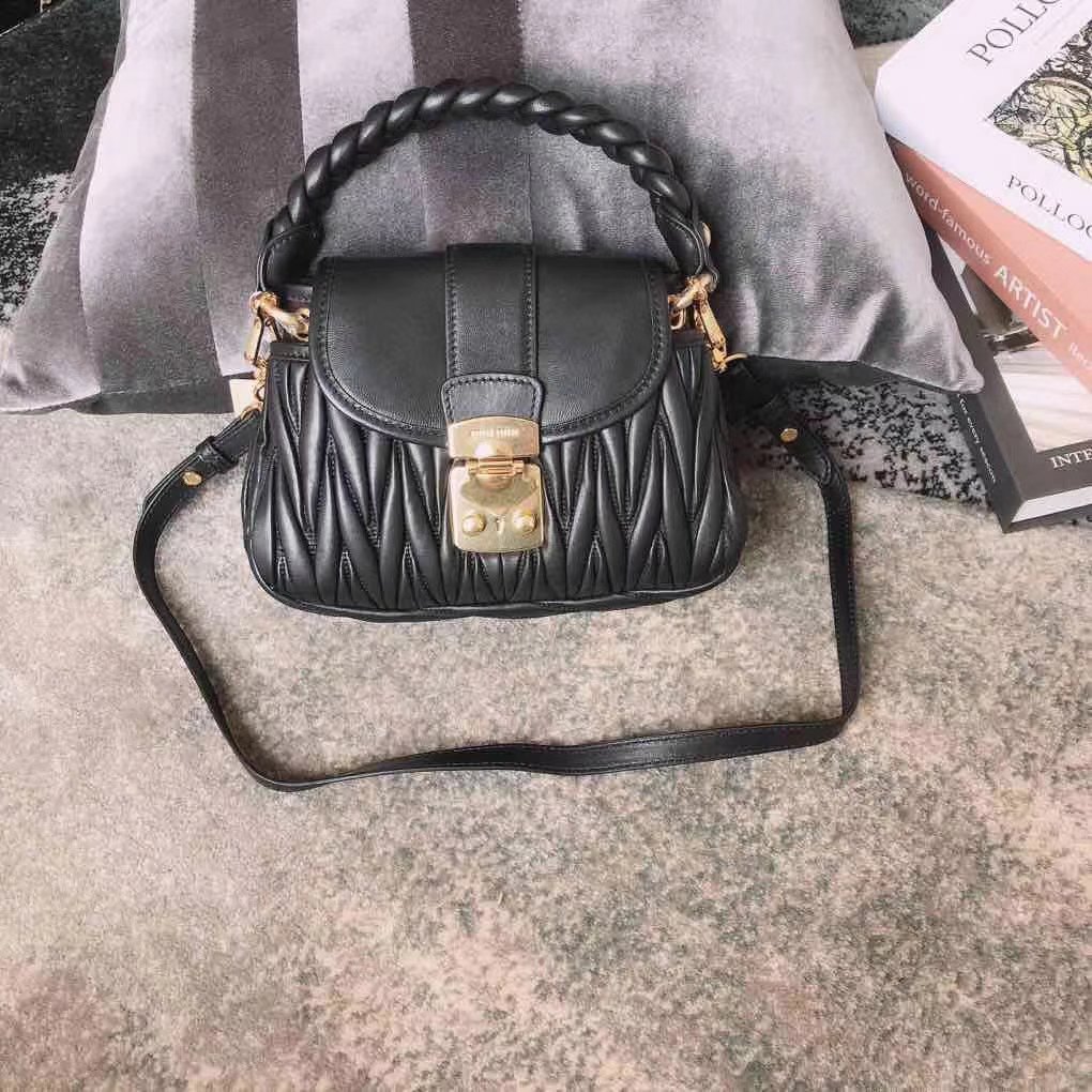 Miu Miu Coffer bag made of matelassé leather with a braided top handle