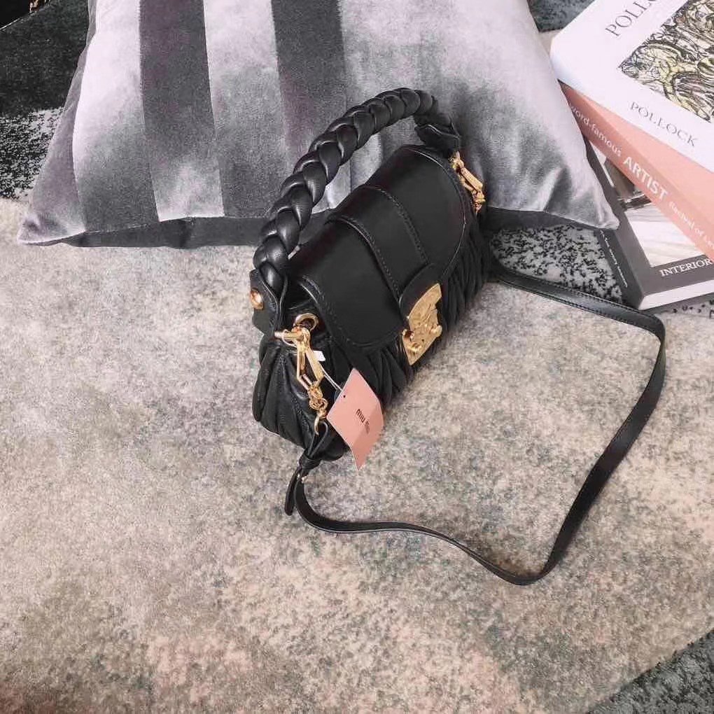 Miu Miu Coffer bag made of matelassé leather with a braided top handle