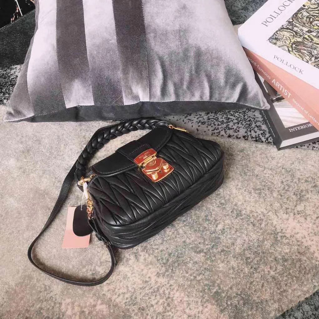 Miu Miu Coffer bag made of matelassé leather with a braided top handle