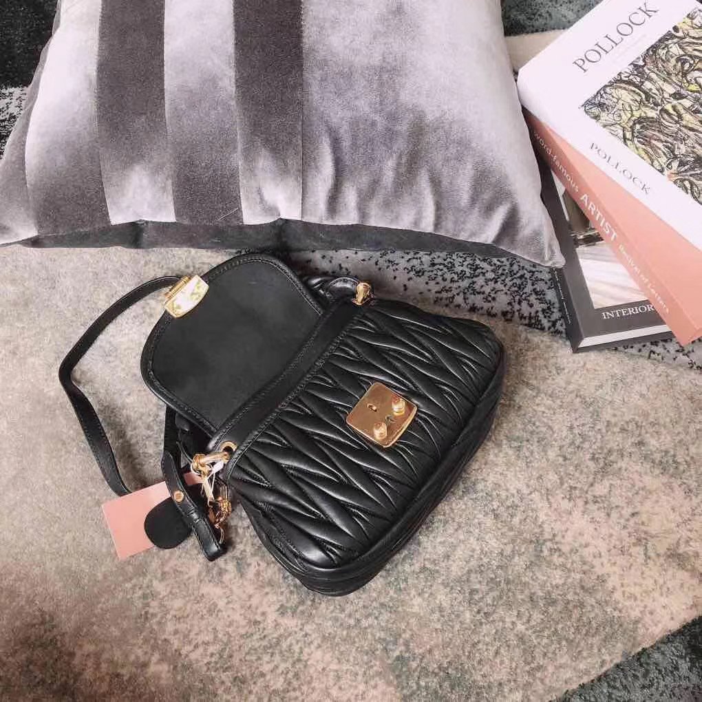 Miu Miu Coffer bag made of matelassé leather with a braided top handle