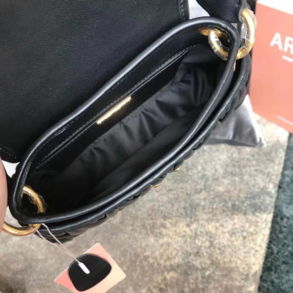 Miu Miu Coffer bag made of matelassé leather with a braided top handle