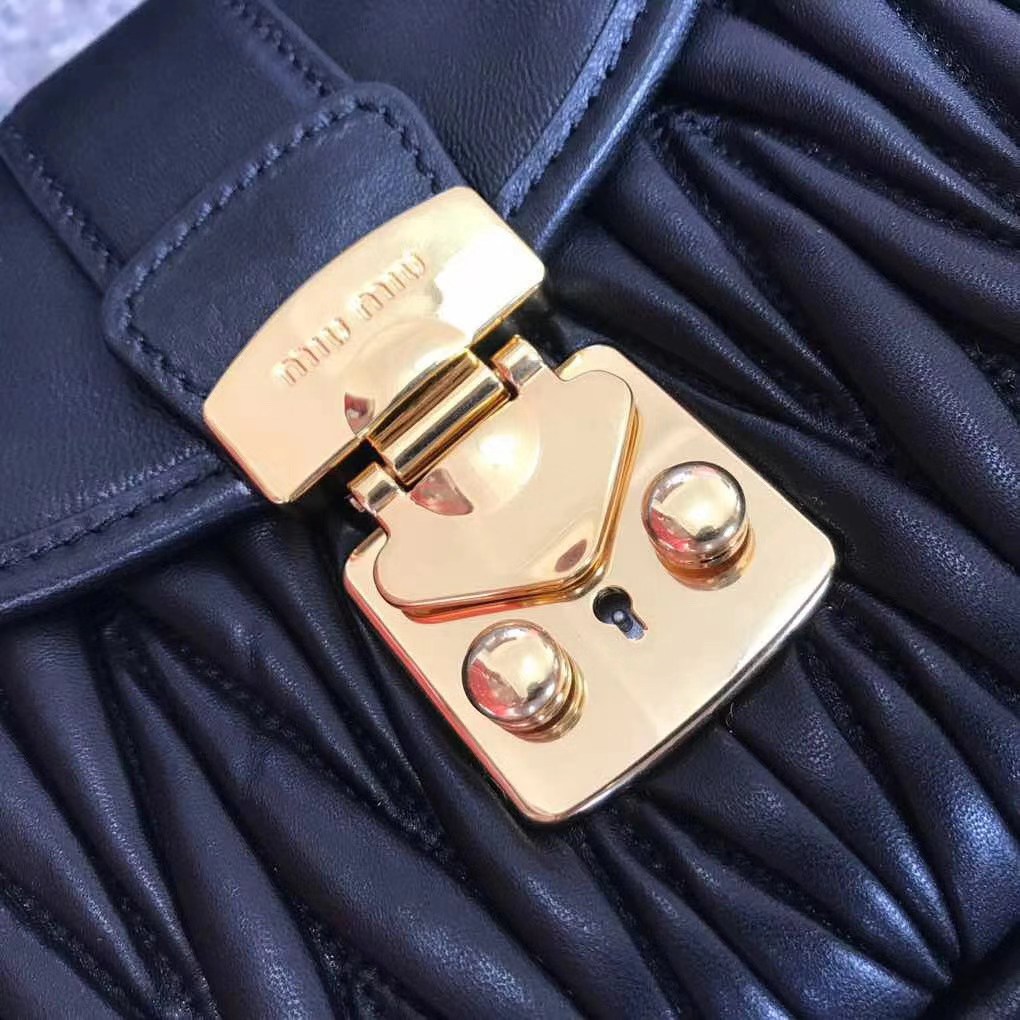 Miu Miu Coffer bag made of matelassé leather with a braided top handle