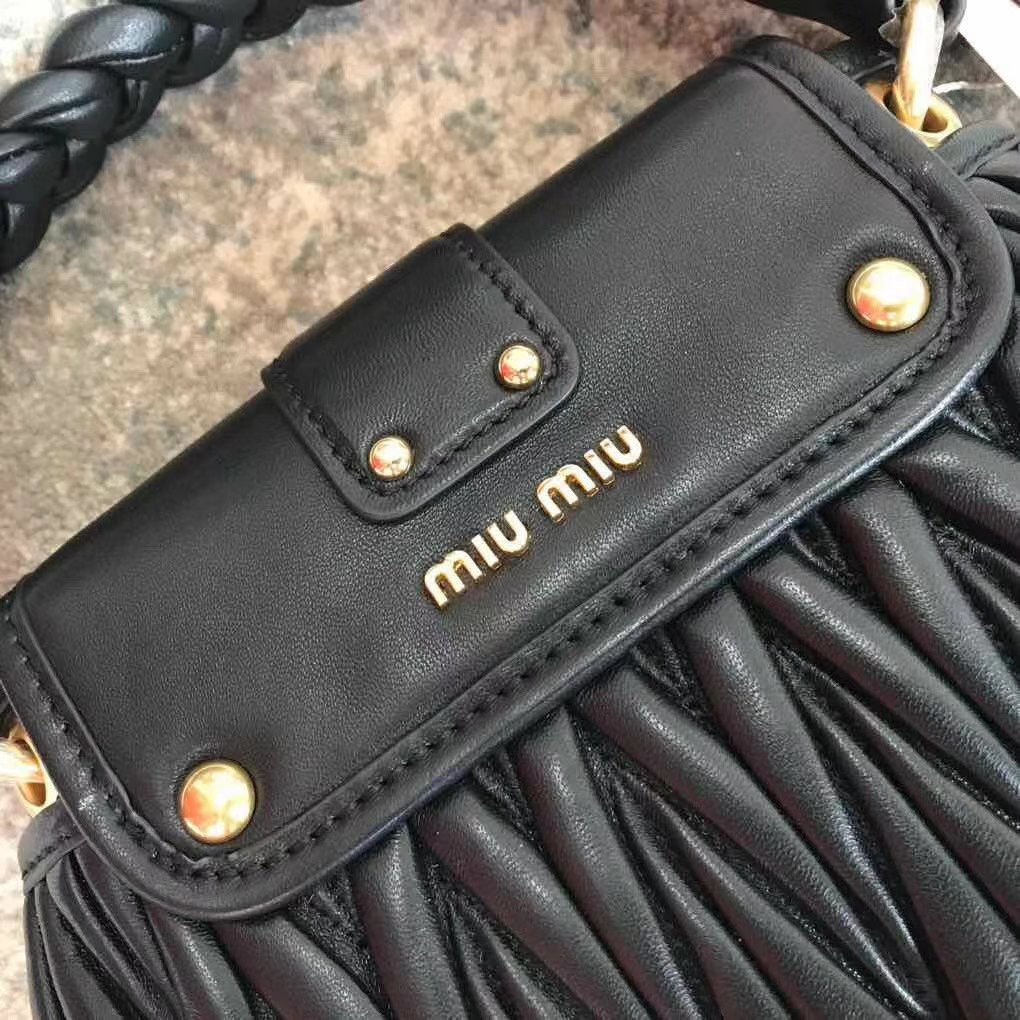 Miu Miu Coffer bag made of matelassé leather with a braided top handle