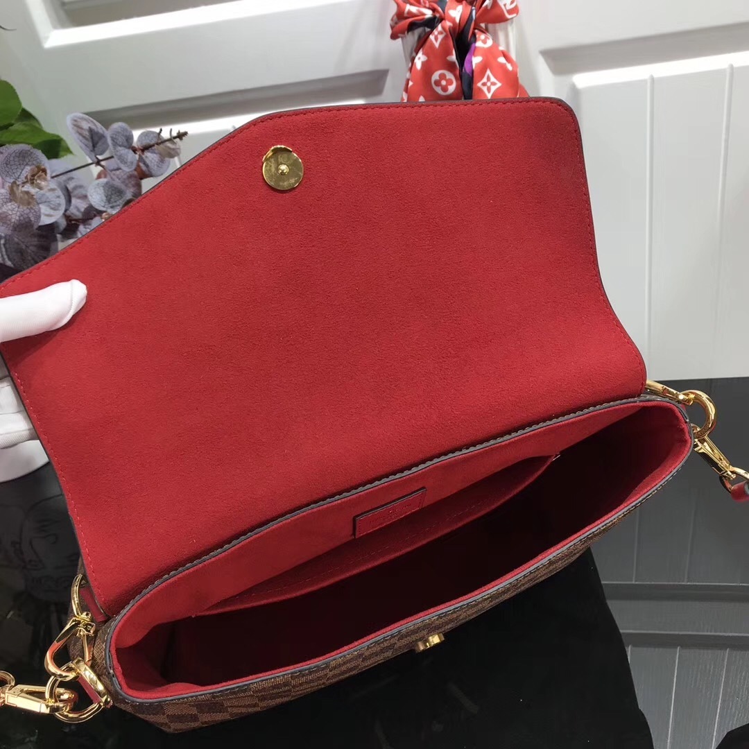 LV Beaubourg MM handbag made from Damier Ebene canvas with red leather details.