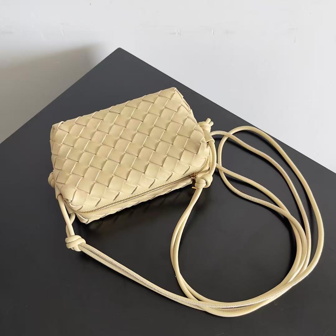 Bottega Veneta Mini Loop Camera Bag crafted from woven leather in an iconic intrecciato style