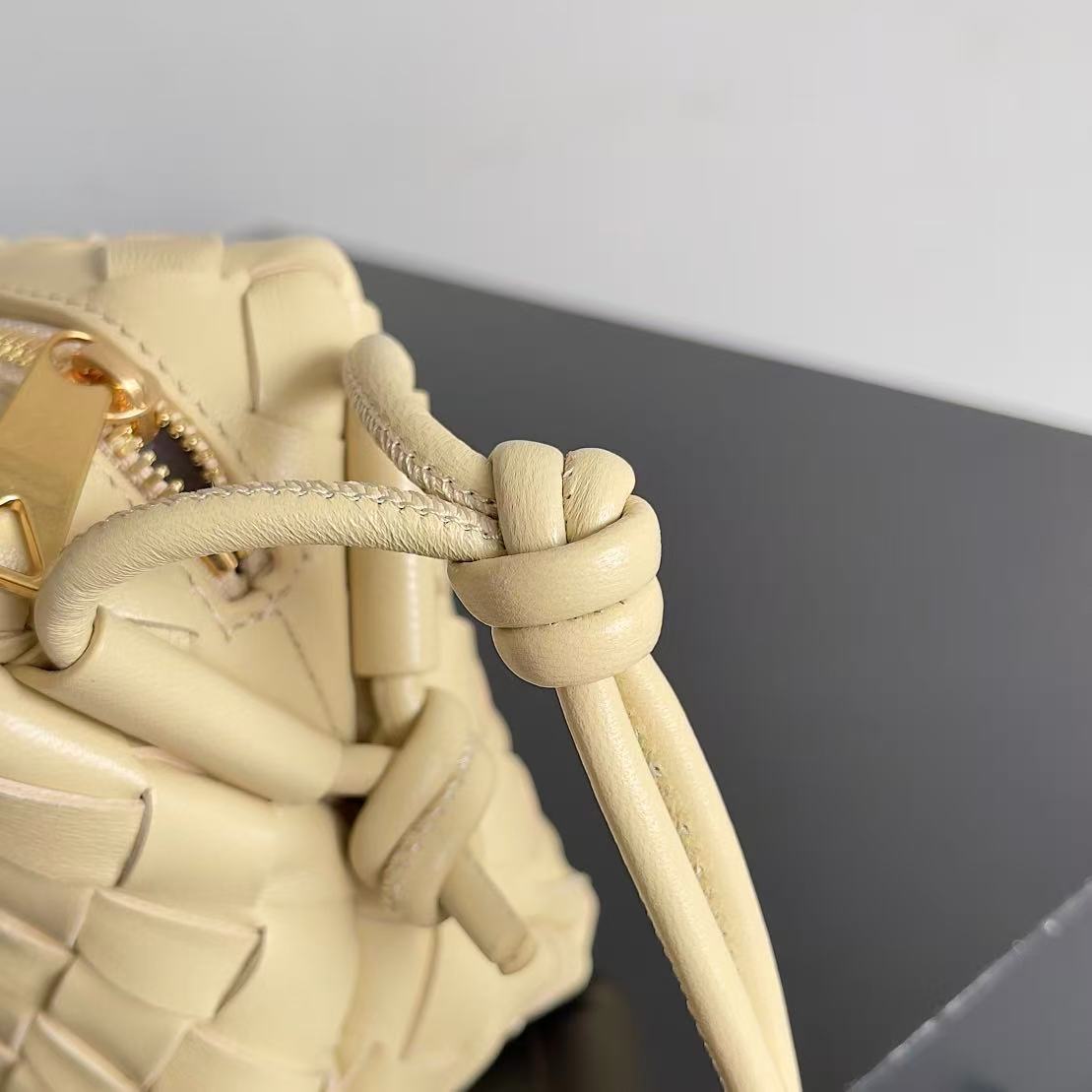 Bottega Veneta Mini Loop Camera Bag crafted from woven leather in an iconic intrecciato style