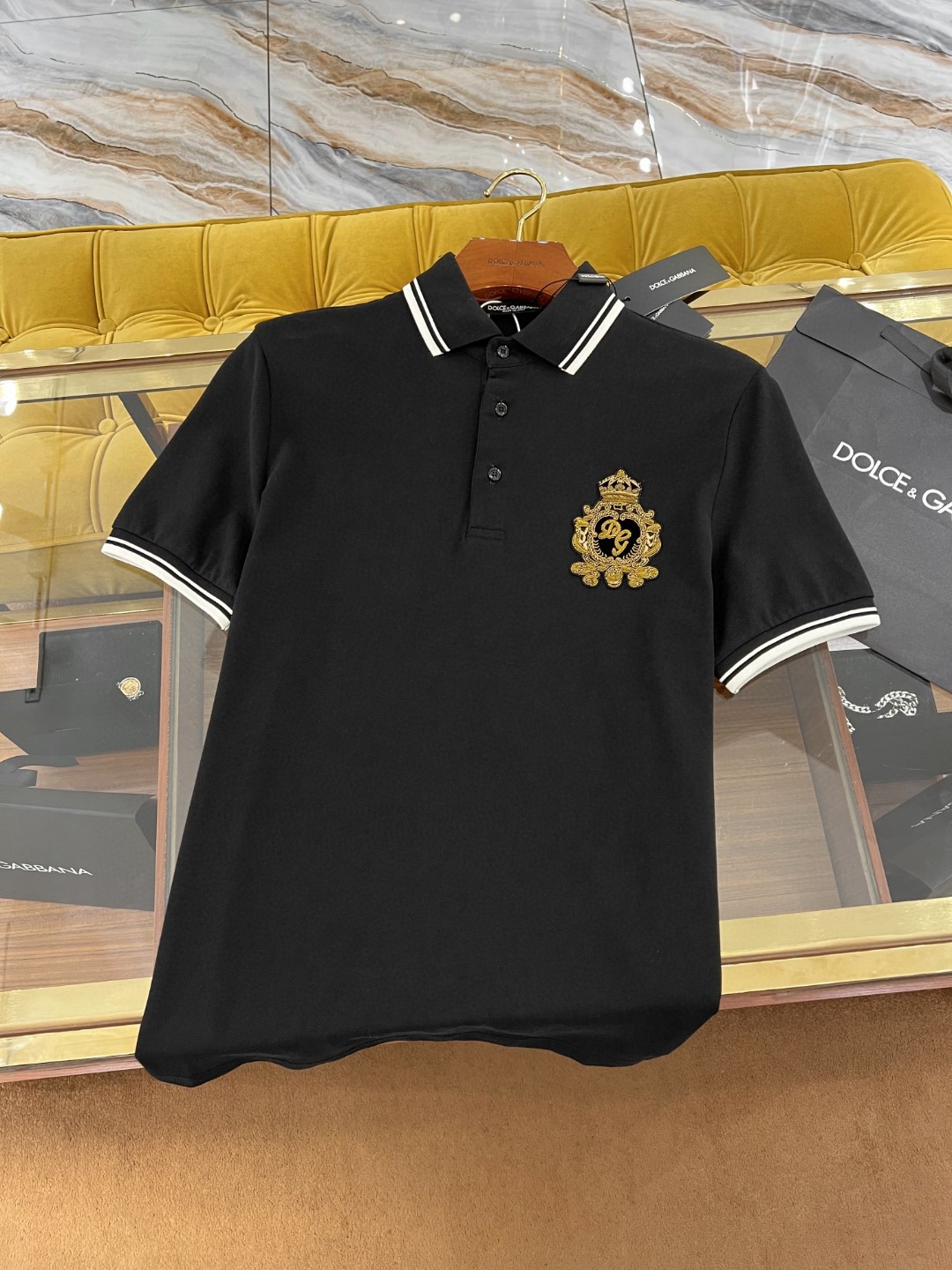 Dolce and Gabbana navy blue cotton polo shirt featuring heraldic patch embroidery