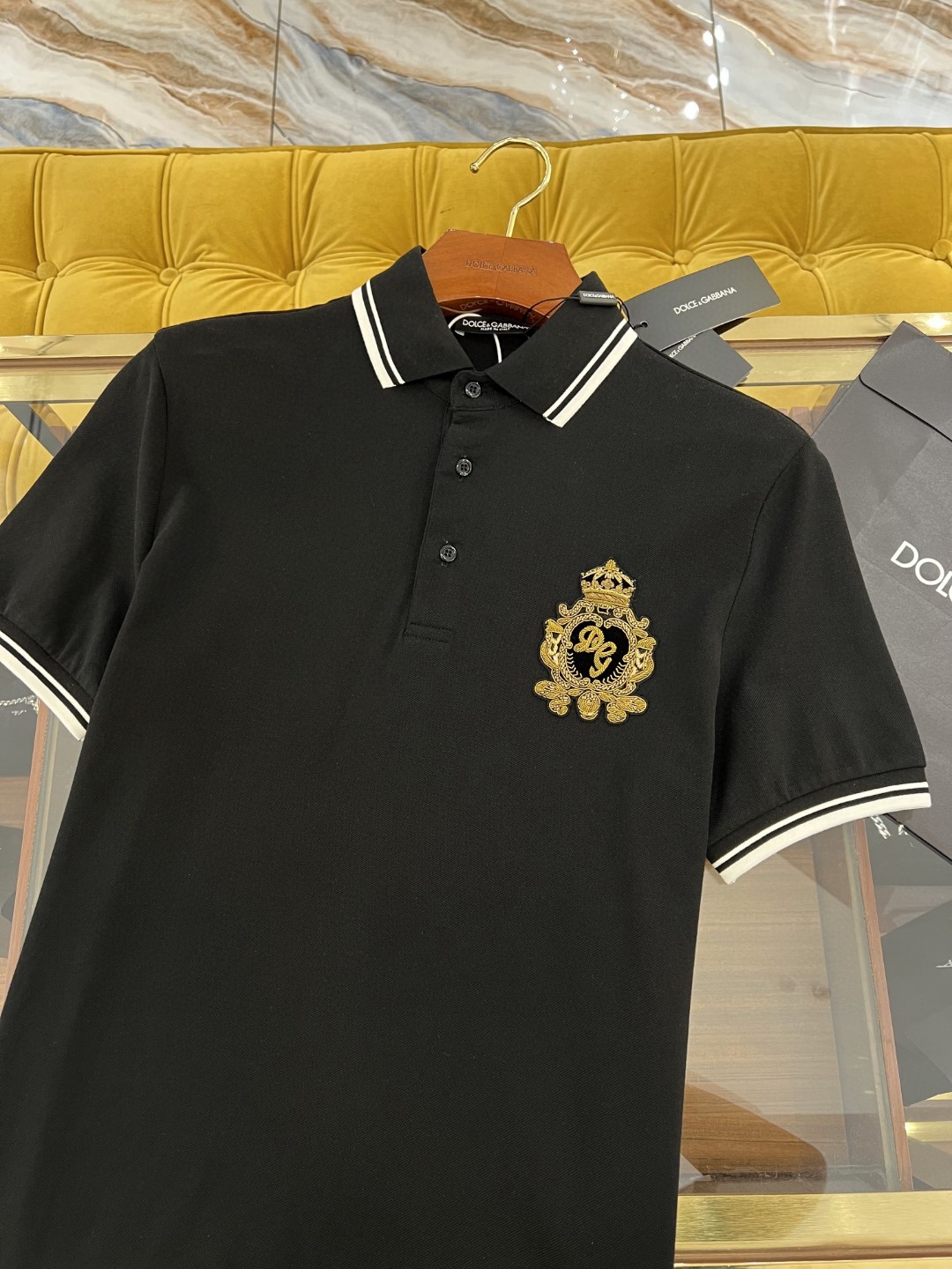 Dolce and Gabbana navy blue cotton polo shirt featuring heraldic patch embroidery