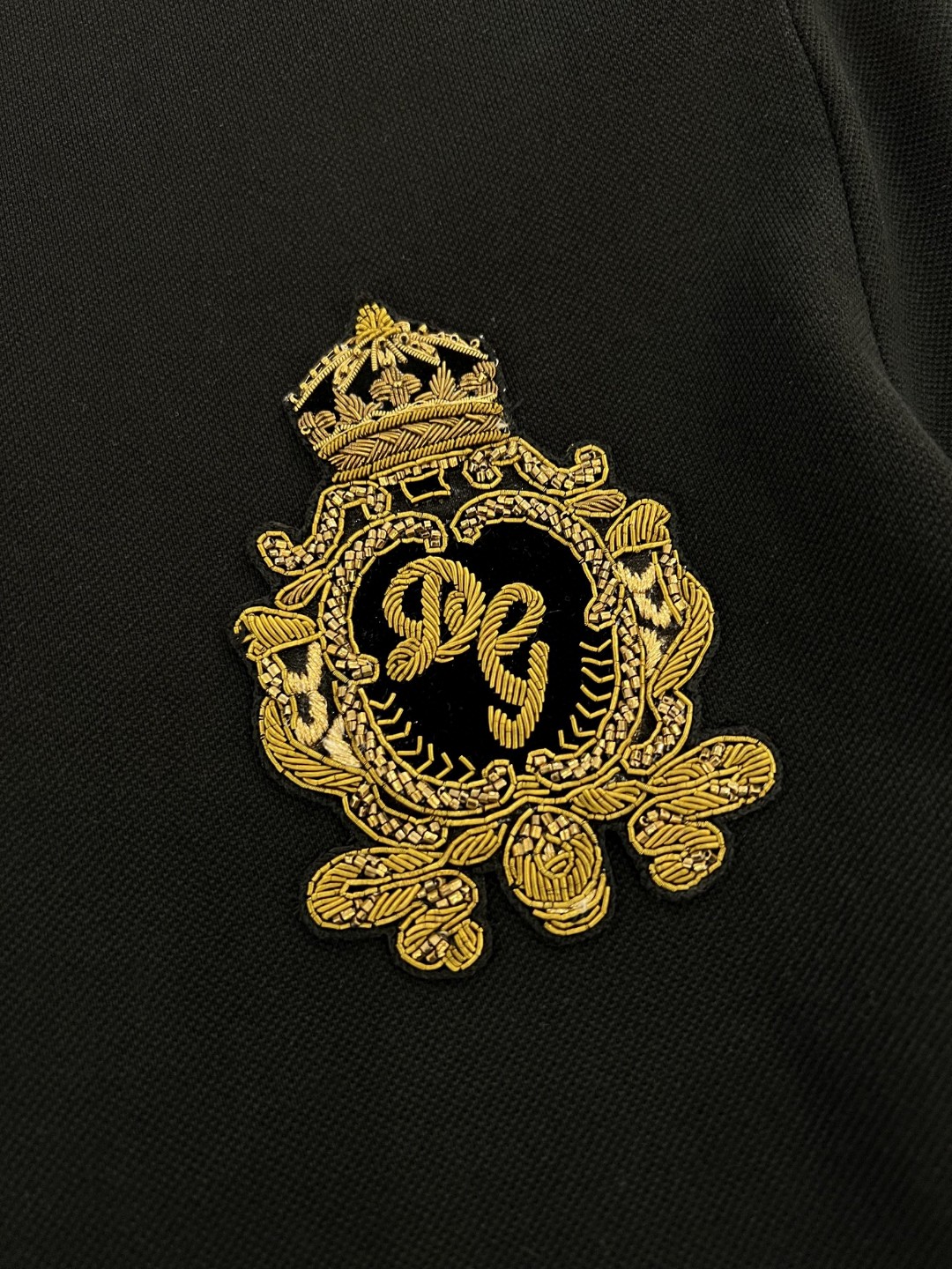 Dolce and Gabbana navy blue cotton polo shirt featuring heraldic patch embroidery