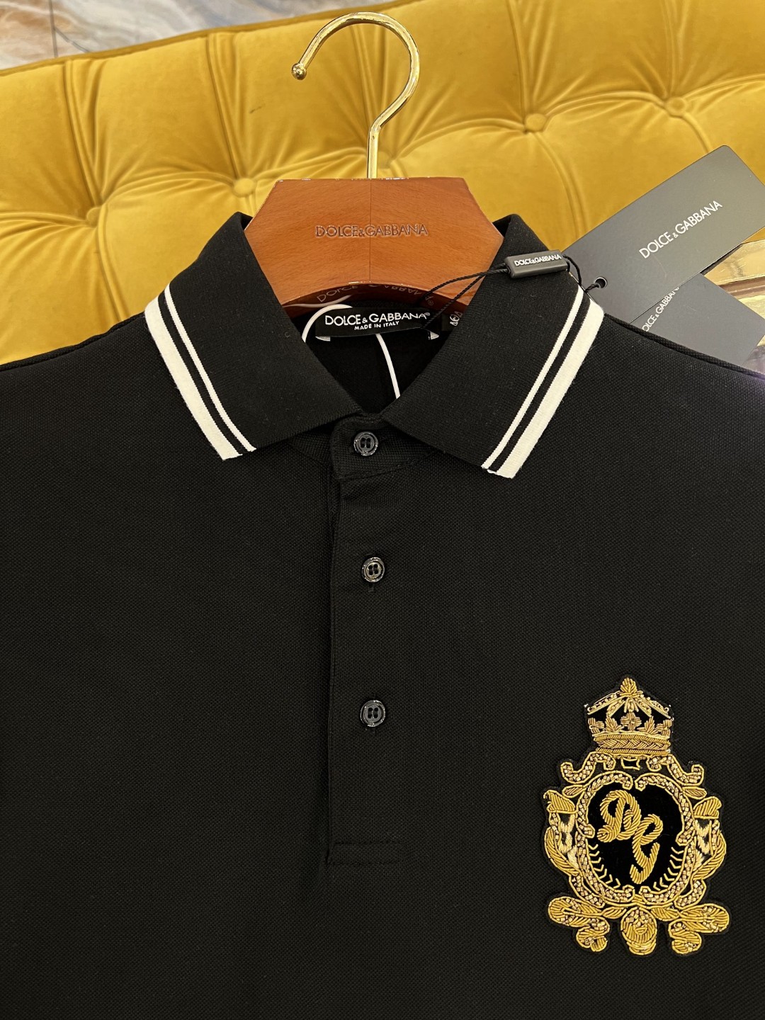 Dolce and Gabbana navy blue cotton polo shirt featuring heraldic patch embroidery