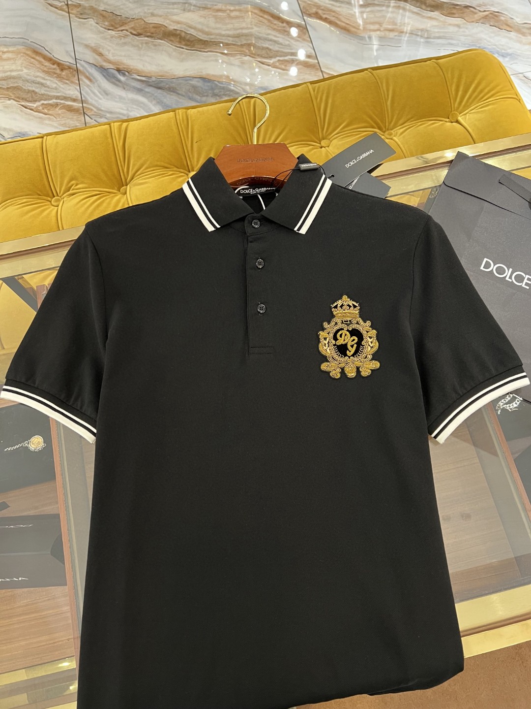 Dolce and Gabbana navy blue cotton polo shirt featuring heraldic patch embroidery