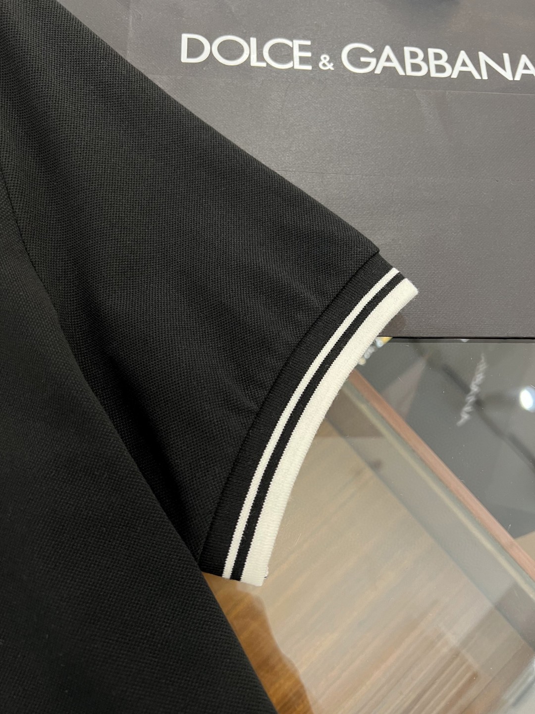 Dolce and Gabbana navy blue cotton polo shirt featuring heraldic patch embroidery