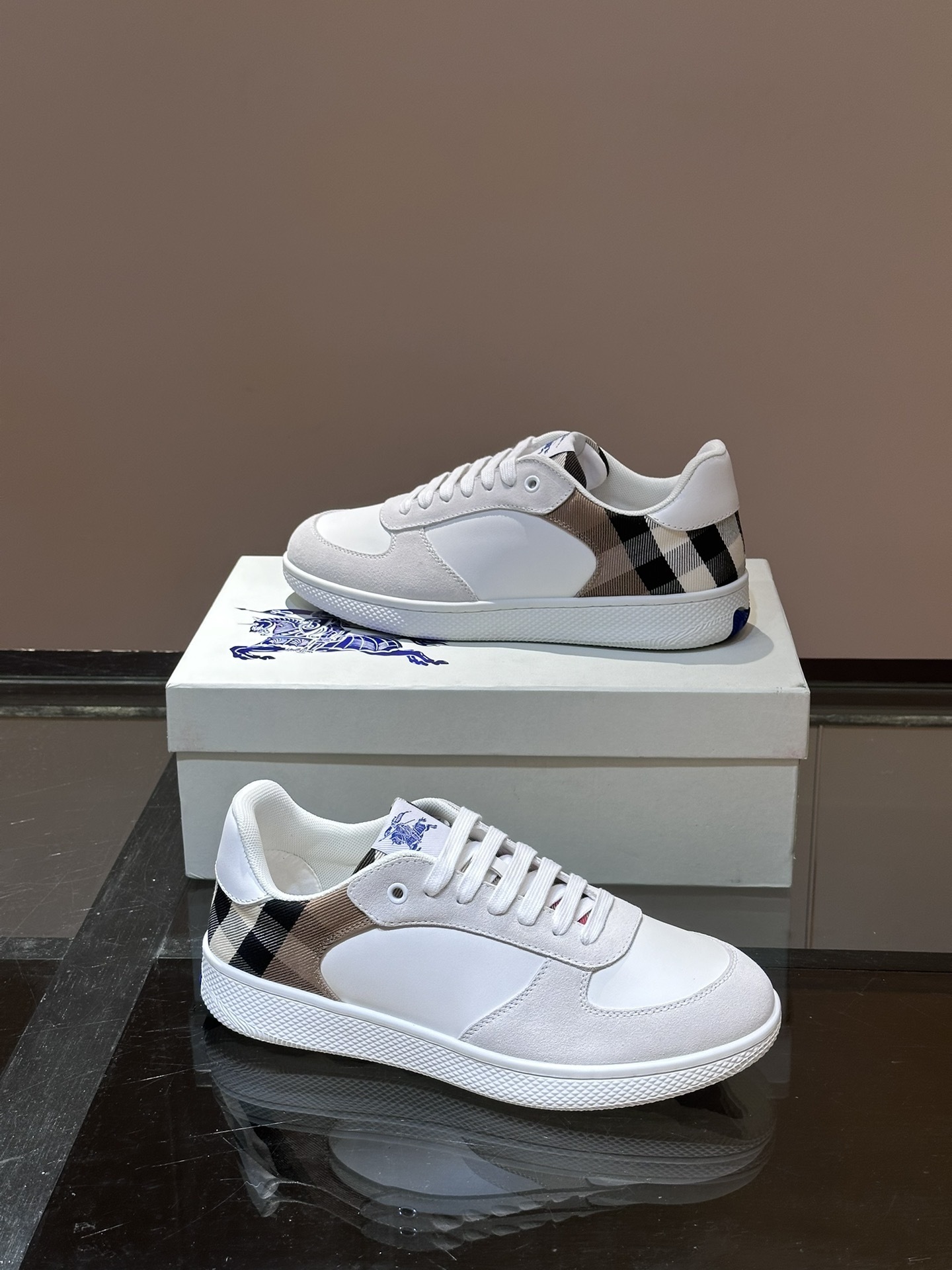 Burberry Terrace sneakers, a style crafted in smooth calf leather with a woven check panel.