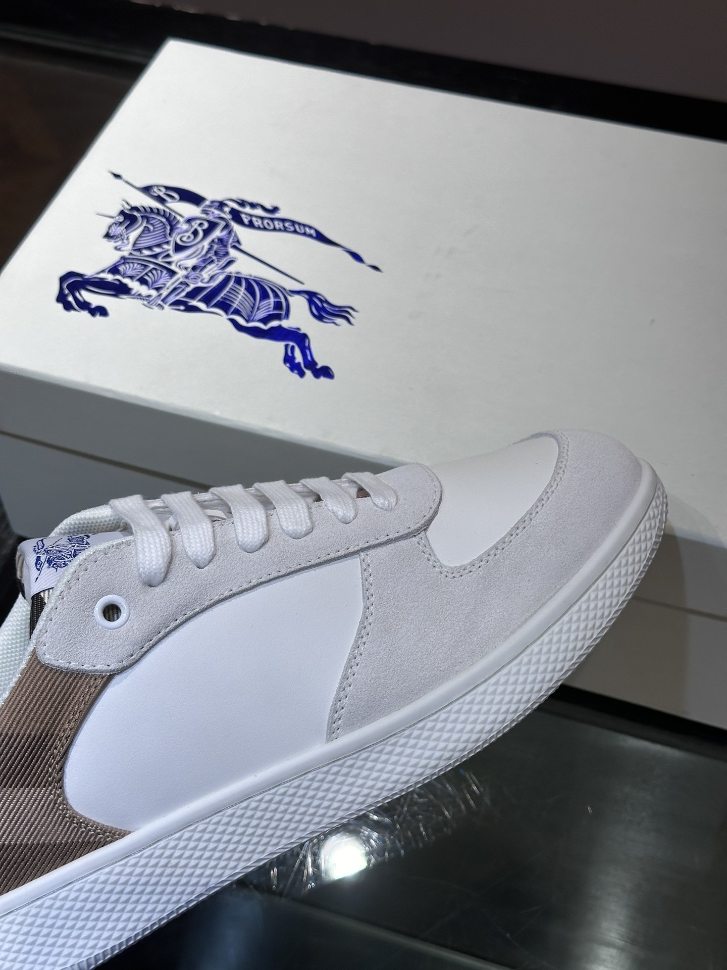 Burberry Terrace sneakers, a style crafted in smooth calf leather with a woven check panel.