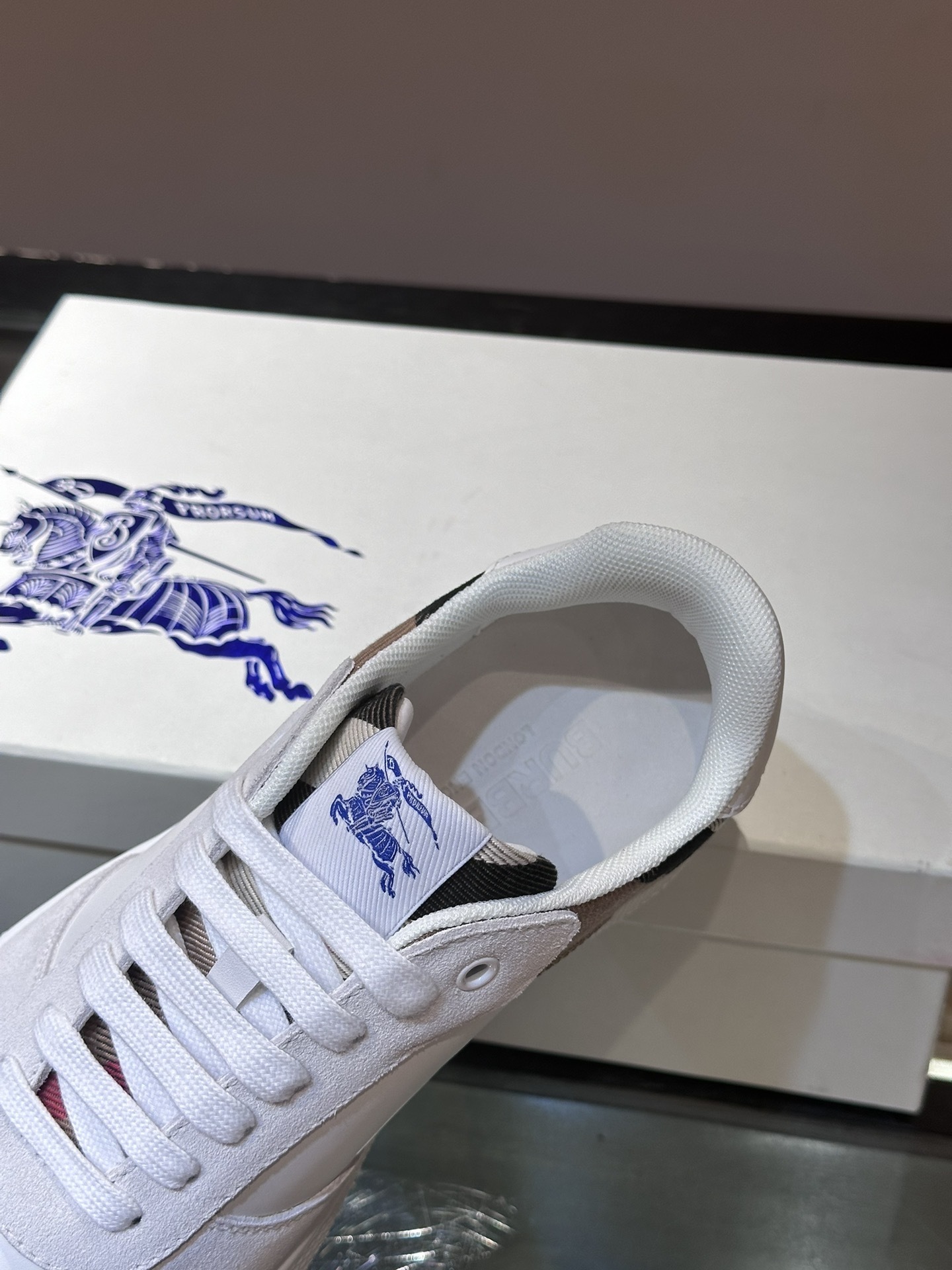 Burberry Terrace sneakers, a style crafted in smooth calf leather with a woven check panel.