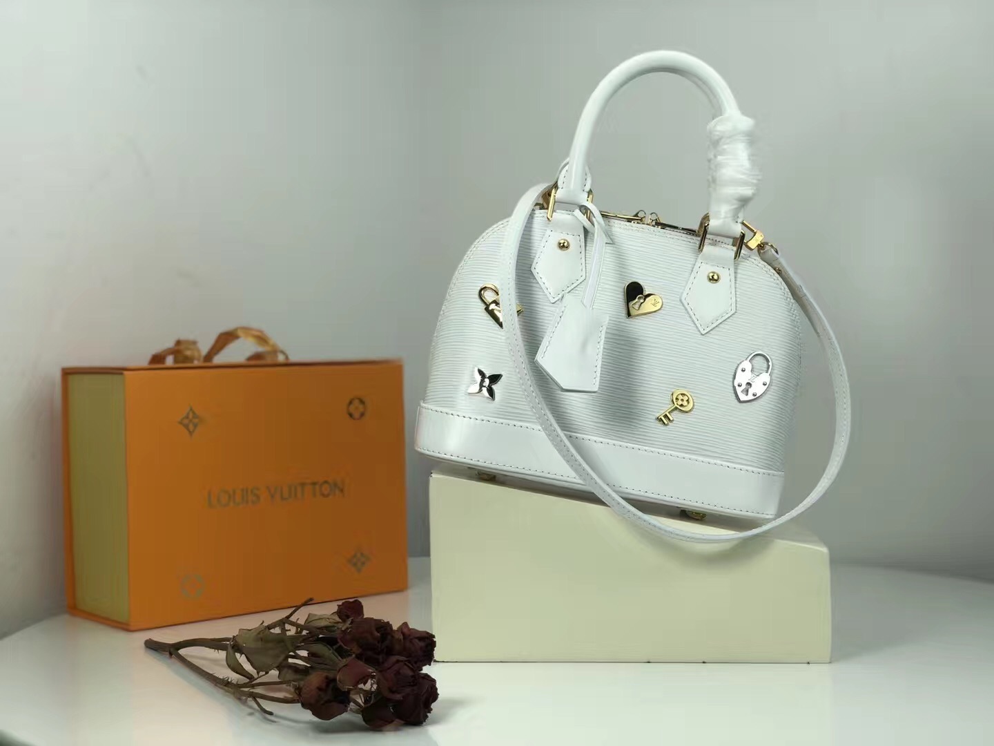 LV white Epi leather Alma BB bag from the 2016 "Love Lock" collection.
