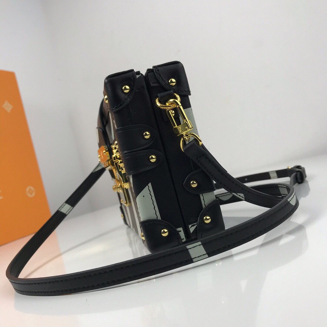 LV Petite Malle handbag is inspired by the brand's historic trunks, featuring a distinctive structured shape, gold-tone hardware, and an S-lock clasp.