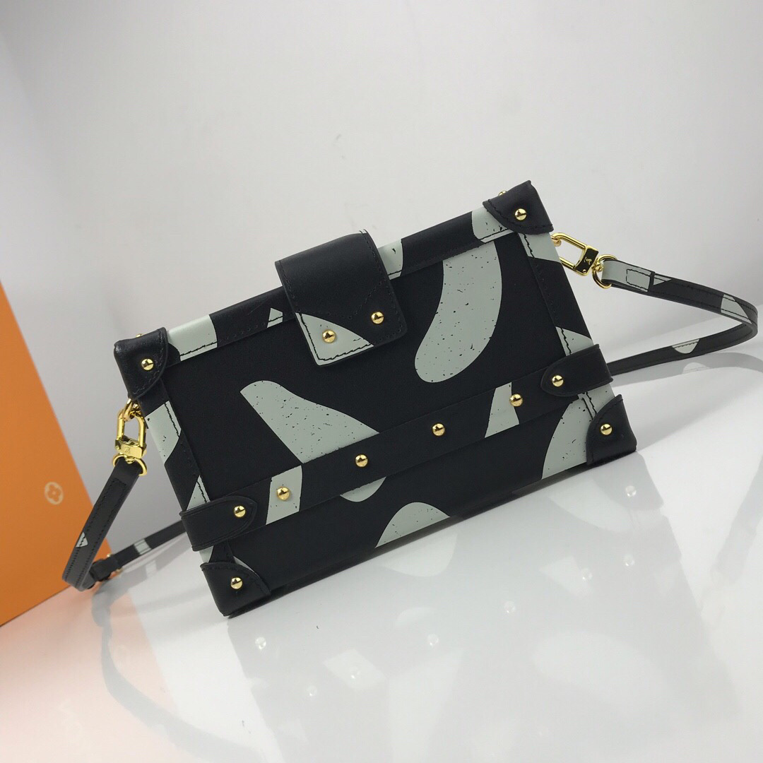 LV Petite Malle handbag is inspired by the brand's historic trunks, featuring a distinctive structured shape, gold-tone hardware, and an S-lock clasp.