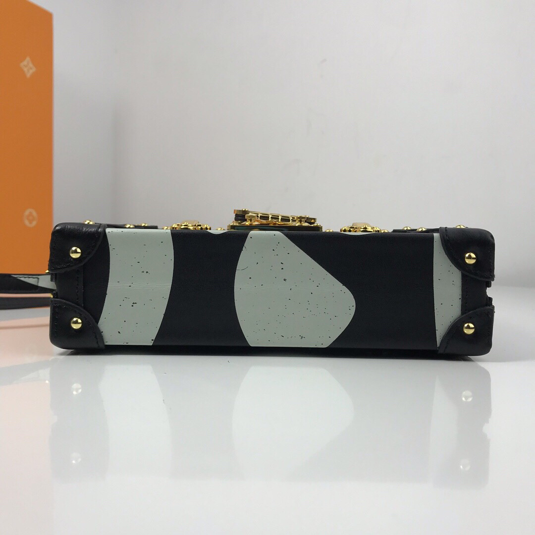 LV Petite Malle handbag is inspired by the brand's historic trunks, featuring a distinctive structured shape, gold-tone hardware, and an S-lock clasp.