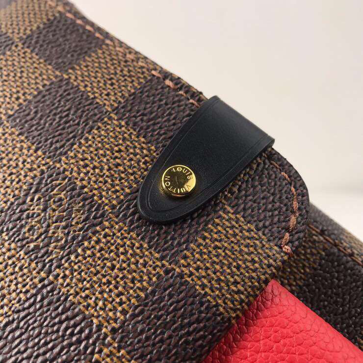 LV Vavin PM bag crafted from Damier Ebene canvas with a red leather flap and gold-tone chain strap.