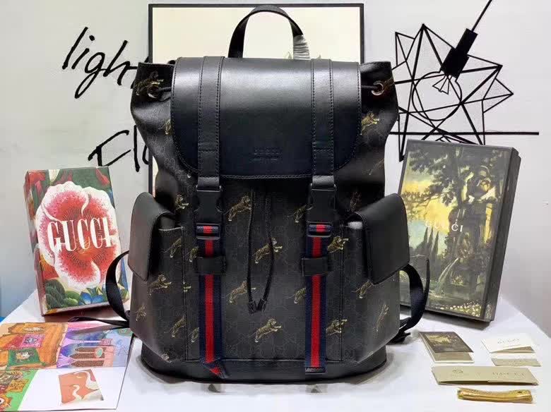 Gucci GG Supreme Backpack featuring a tiger print design.