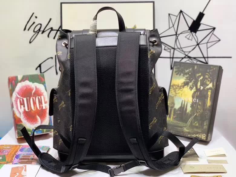 Gucci GG Supreme Backpack featuring a tiger print design.