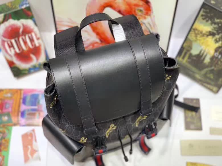 Gucci GG Supreme Backpack featuring a tiger print design.