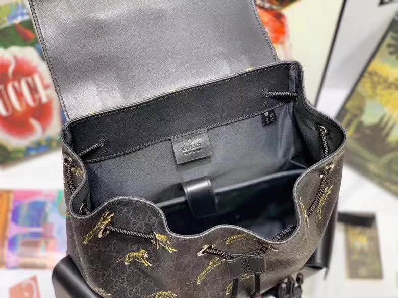 Gucci GG Supreme Backpack featuring a tiger print design.