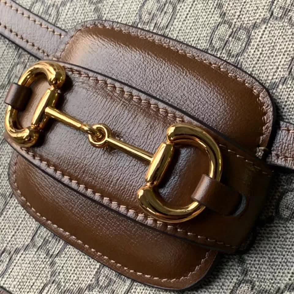 Gucci Horsebit 1955 shoulder bag, featuring the brand's iconic GG monogram canvas with brown leather trim and gold-tone horsebit hardware