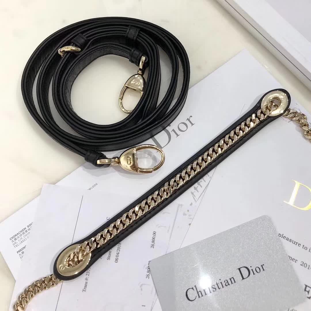 christian dior black quilted lambskin leather Lady Dior bag featuring distinctive Cannage stitching and pale gold-finish metal D.I.O.R. charms