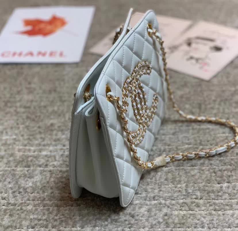 Chanel Calfskin Quilted CC Chain Accordion Tote featuring a diamond-quilted leather body and a distinctive leather-threaded gold chain Chanel CC logo on the front