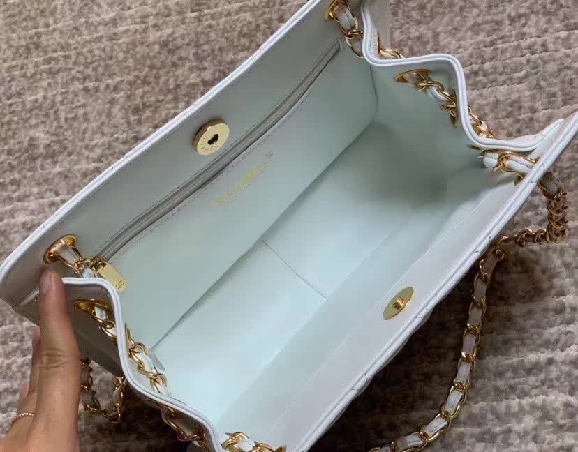 Chanel Calfskin Quilted CC Chain Accordion Tote featuring a diamond-quilted leather body and a distinctive leather-threaded gold chain Chanel CC logo on the front