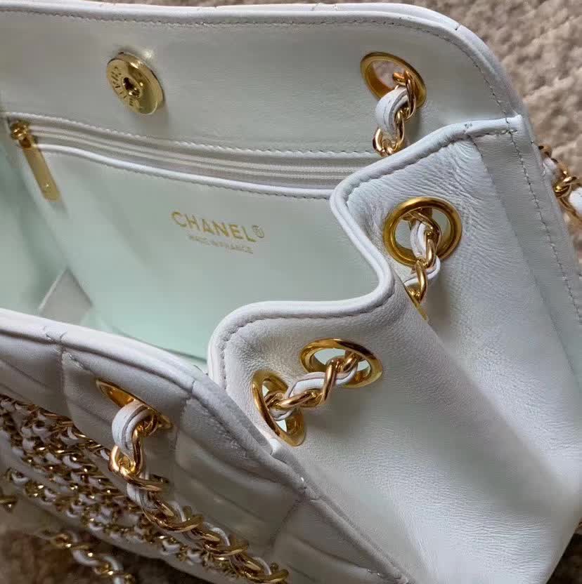 Chanel Calfskin Quilted CC Chain Accordion Tote featuring a diamond-quilted leather body and a distinctive leather-threaded gold chain Chanel CC logo on the front