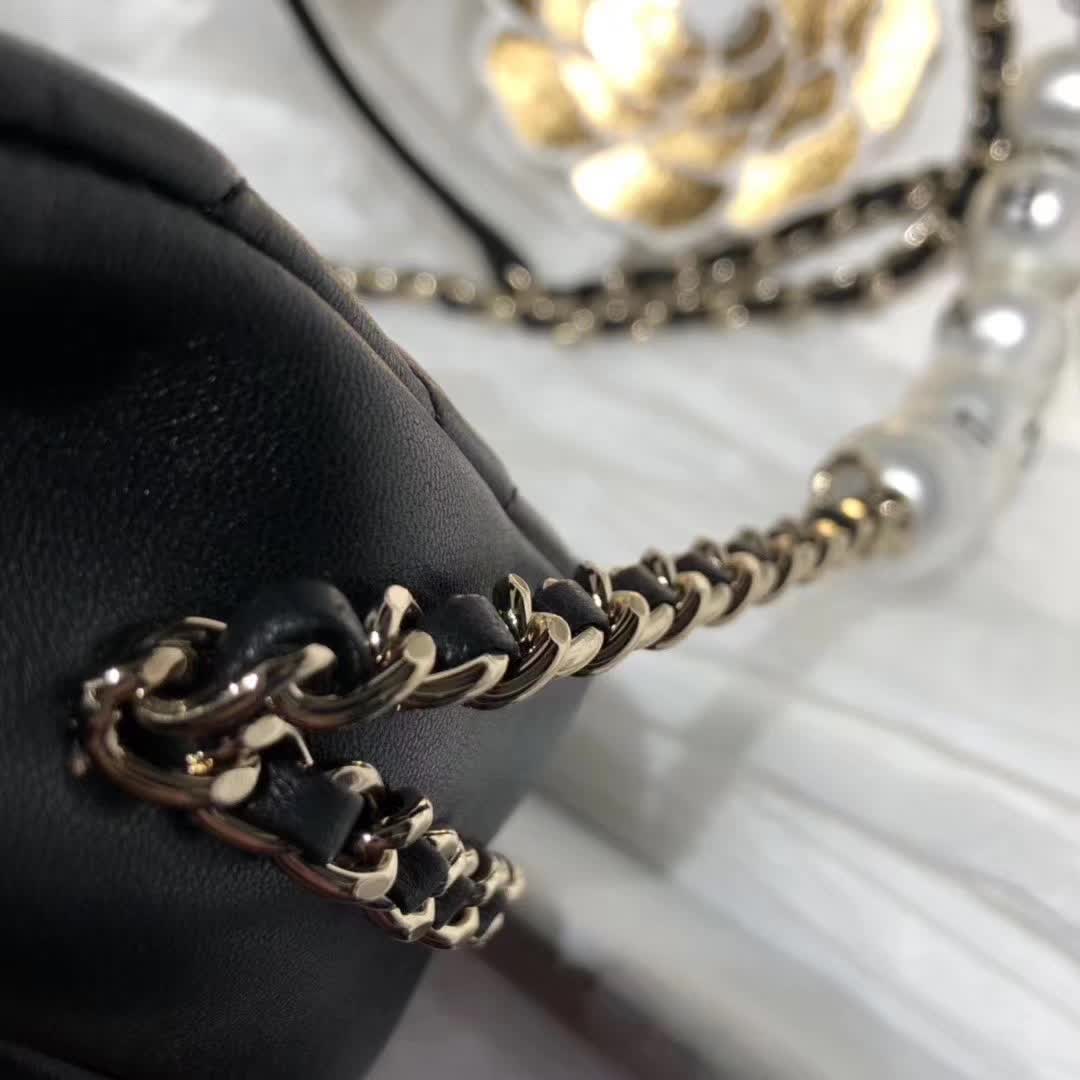 Chanel My Precious Pearls Chain Flap Bag crafted from black lambskin leather and featuring gold-toned hardware