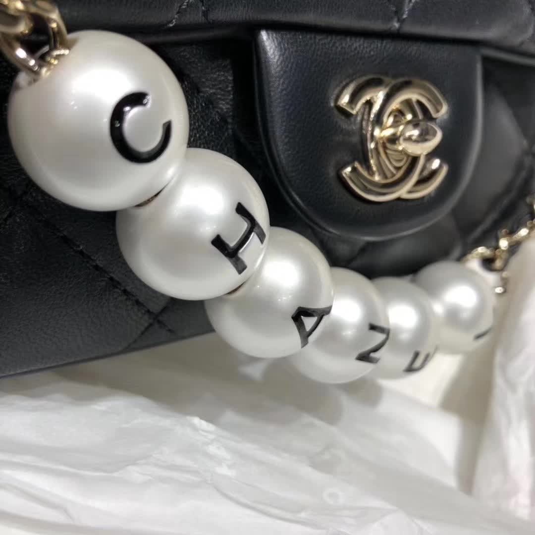 Chanel My Precious Pearls Chain Flap Bag crafted from black lambskin leather and featuring gold-toned hardware