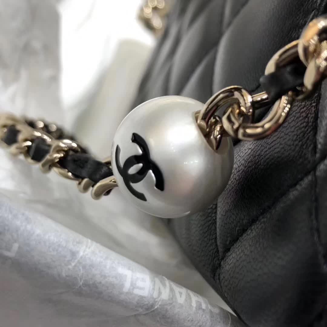 Chanel My Precious Pearls Chain Flap Bag crafted from black lambskin leather and featuring gold-toned hardware