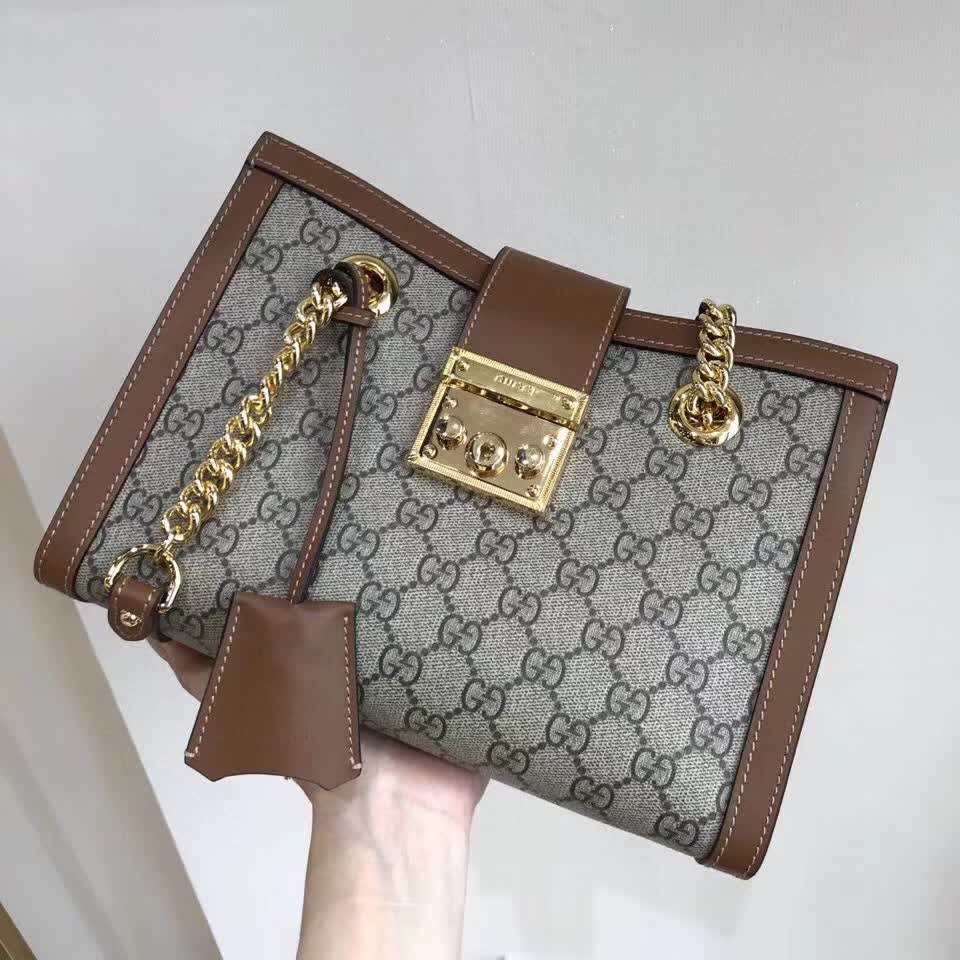 Gucci Padlock Small GG Shoulder Bag featuring GG Supreme canvas and brown leather trim