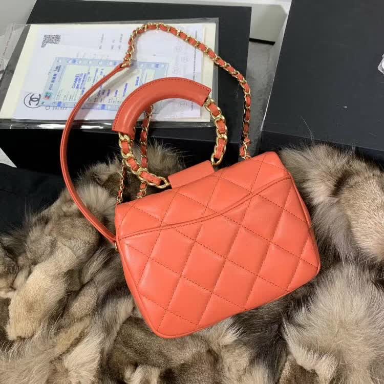 Chanel In The Loop Quilted Lambskin Small Flap Bag in a vibrant red or coral color