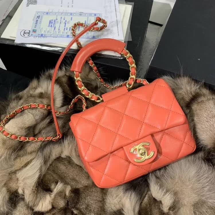 Chanel In The Loop Quilted Lambskin Small Flap Bag in a vibrant red or coral color