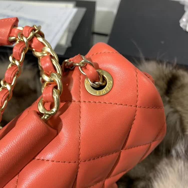 Chanel In The Loop Quilted Lambskin Small Flap Bag in a vibrant red or coral color