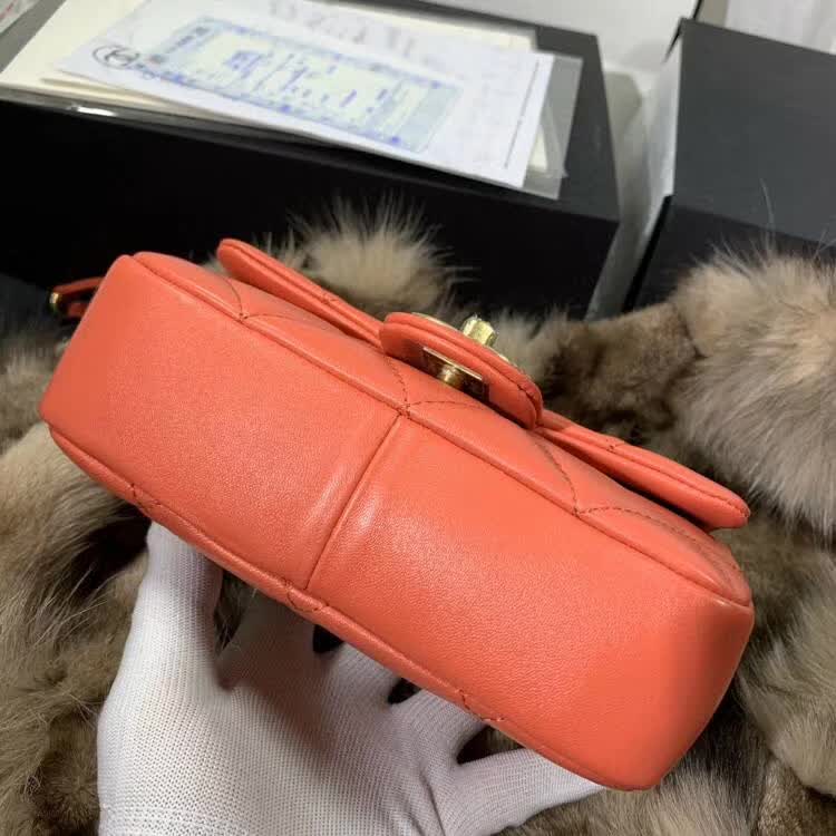 Chanel In The Loop Quilted Lambskin Small Flap Bag in a vibrant red or coral color