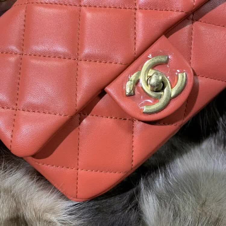 Chanel In The Loop Quilted Lambskin Small Flap Bag in a vibrant red or coral color