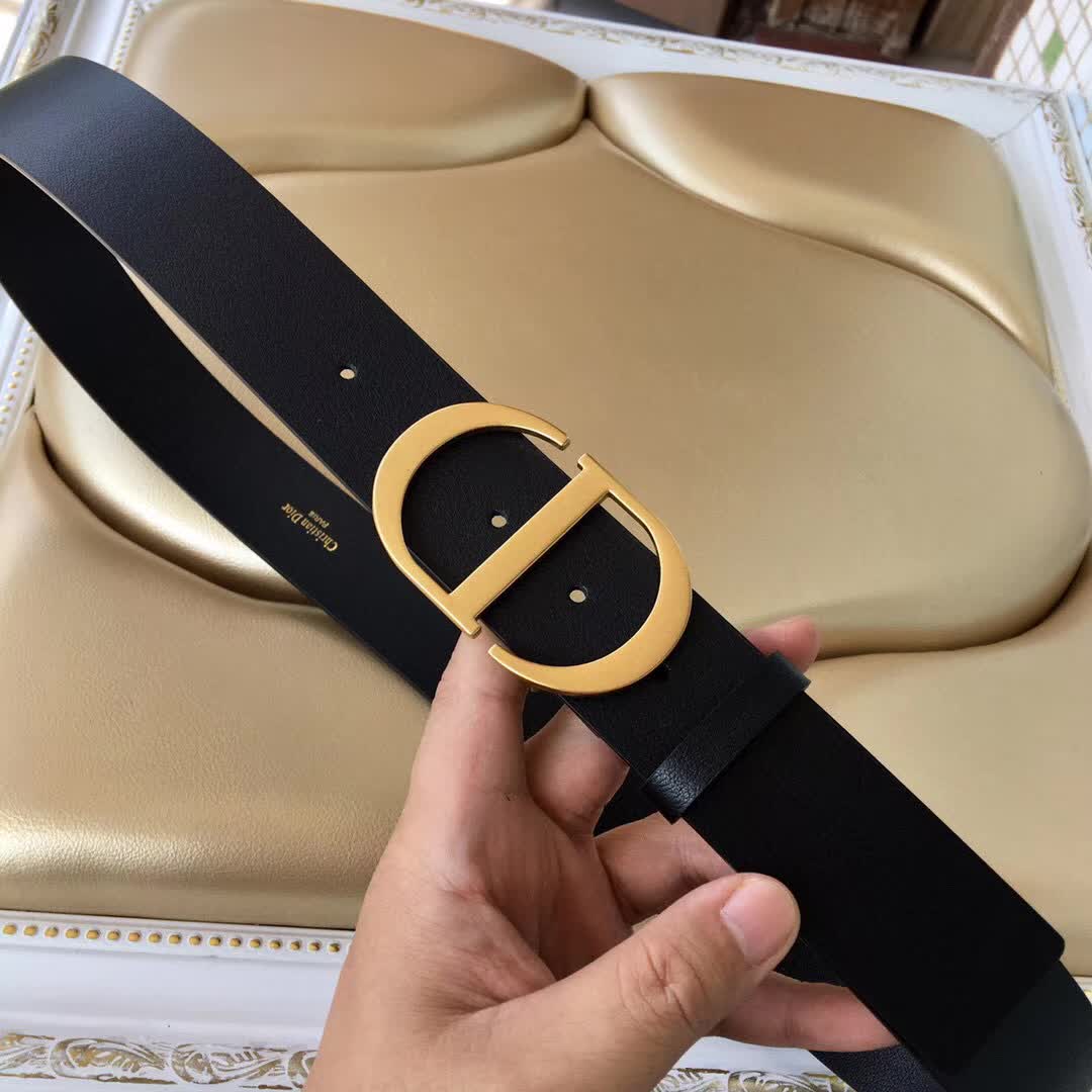 Christian Dior 30 Montaigne belt is crafted from smooth black calfskin and features a signature gold-finish metal "CD" buckle