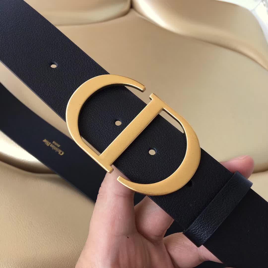 Christian Dior 30 Montaigne belt is crafted from smooth black calfskin and features a signature gold-finish metal "CD" buckle