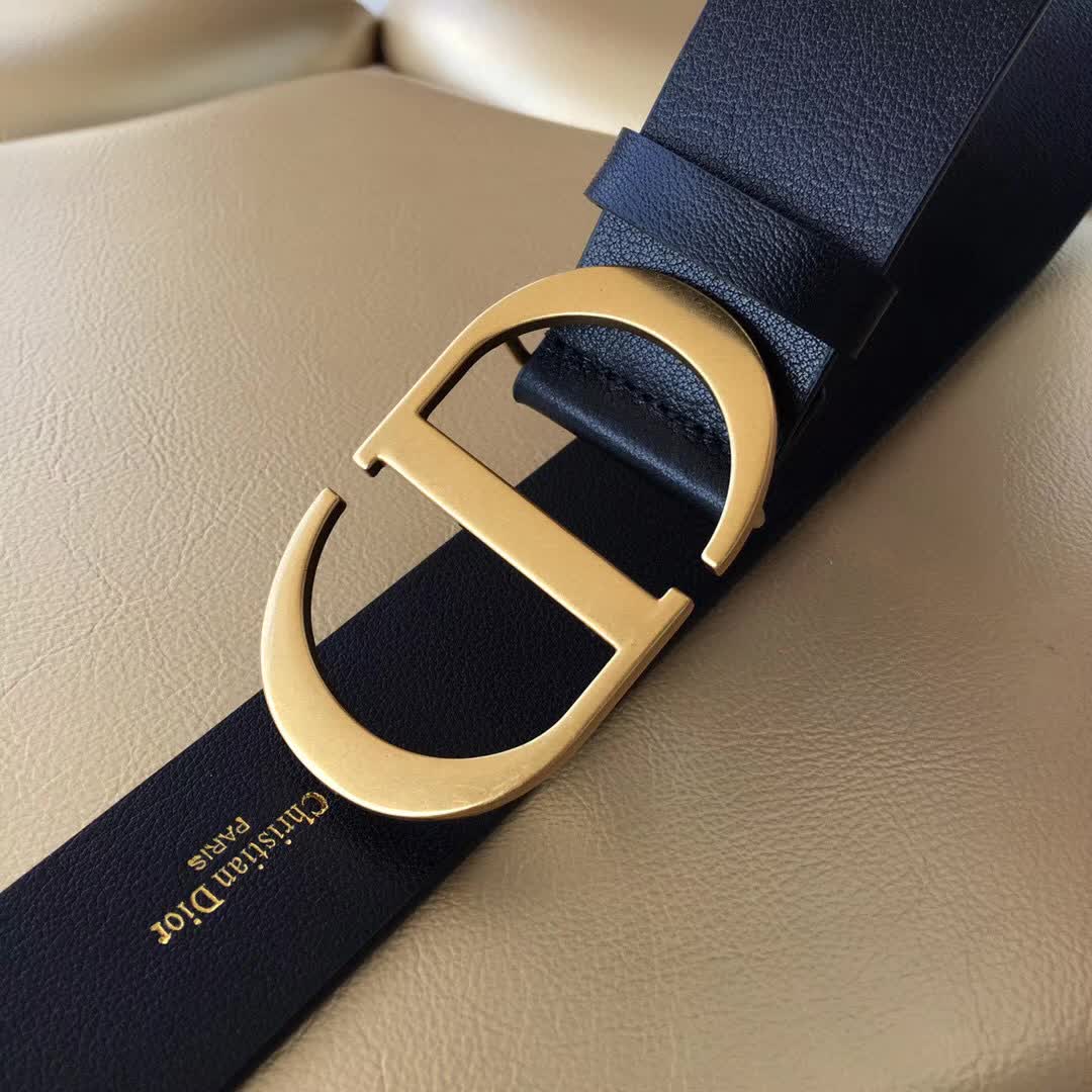 Christian Dior 30 Montaigne belt is crafted from smooth black calfskin and features a signature gold-finish metal "CD" buckle