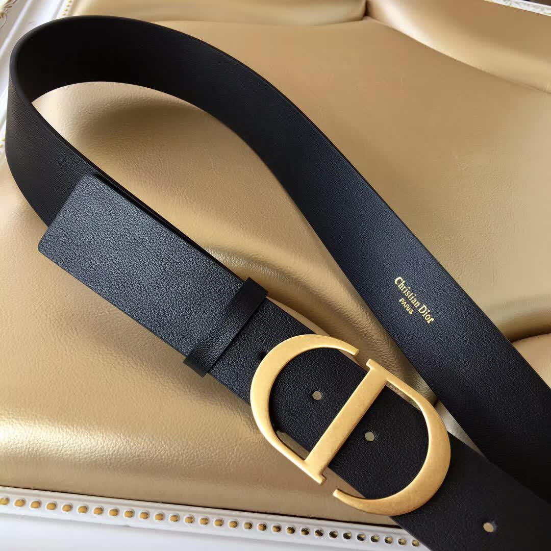 Christian Dior 30 Montaigne belt is crafted from smooth black calfskin and features a signature gold-finish metal "CD" buckle